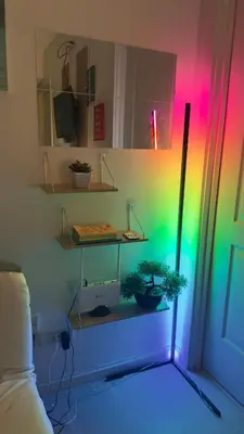 a room with a shelf with plants and a colorful light at 2- Bedroom Condo in Metro Manila - Azure Beach in Manila