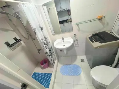 a small bathroom with a toilet and a sink at Sea Affordable staycation in Manila
