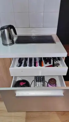 a white kitchen shelf with a pot on it at The Oasis in Knigthsbridge Residence, Makati in Manila