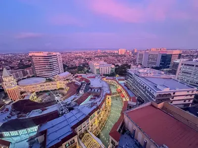an aerial view of a city with tall buildings at nJoy! Tropical Breeze at Venice Grand Canal in Manila