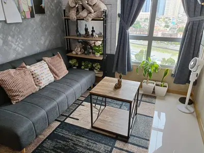 a living room with a couch and a table at Thailand Theme 1BR Free Pool Gym Internet Netflix Sunshine 100 T3 Pioneer Mandaluyong in Manila