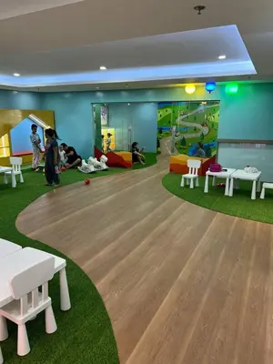 a childrens play room with a table and chairs at Thailand Theme 1BR Free Pool Gym Internet Netflix Sunshine 100 T3 Pioneer Mandaluyong in Manila