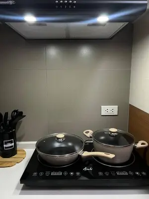two pans sitting on top of a stove in a kitchen at Thailand Theme 1BR Free Pool Gym Internet Netflix Sunshine 100 T3 Pioneer Mandaluyong in Manila