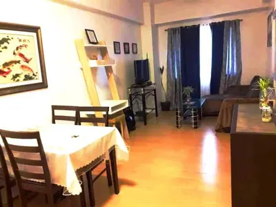 a living room with a table and a couch at Althea's Homestay at Forebeswood Height in Manila