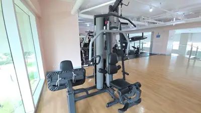 a gym with several tread machines in a room at Cosy Makati Penthouse Studio with Great View in Manila