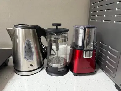 two blenders sitting on a counter next to a blender at European Vibe 1BR Great River City View Free Pool Gym Internet Netflix in Manila