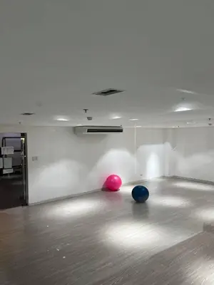 two balls sitting on the floor of a room at European Vibe 1BR Great River City View Free Pool Gym Internet Netflix in Manila