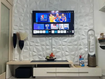 a flat screen tv hanging on a wall at AMD Staycation in Manila