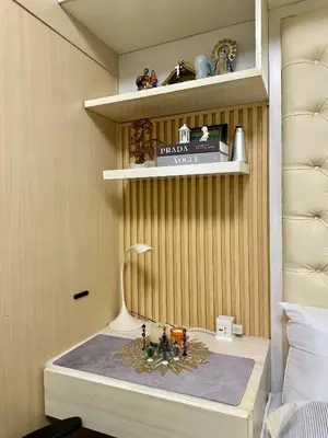 a room with a table with a lamp on it at AMD Staycation in Manila