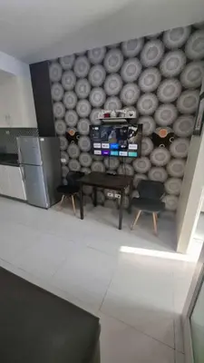 a room with a wall with a table and chairs at Sea Residences in Manila