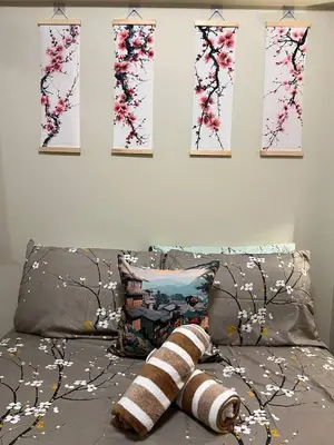 a bed with four paintings on the wall and a bed with pillows at Japan Vibe near Ayala Feliz Mall 2BR 55sqm with Veranda Netflix Pool in Manila