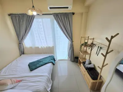 a bedroom with a bed and a large window at Kaizen Pod - Shore Residences Staycation, MOA Complex, Near airport in Manila
