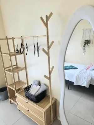 a dressing room with a mirror and a bed at Kaizen Pod - Shore Residences Staycation, MOA Complex, Near airport in Manila