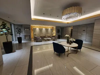 a lobby with a table and chairs and a living room at Entire unit 1 Bedroom with City View - Paul Riley's Pad in Manila