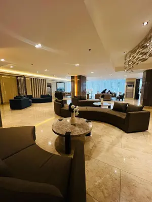 a large living room with couches and a table at Suite 07 MOA GRAND STAY Newly Turn over Only in Manila