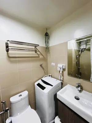 a bathroom with a toilet and a sink at Suite 07 MOA GRAND STAY Newly Turn over Only in Manila