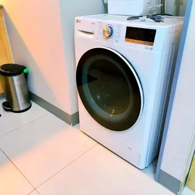 a washing machine in a room with at Cozy Modernistic 1 BR with Veranda! in Manila