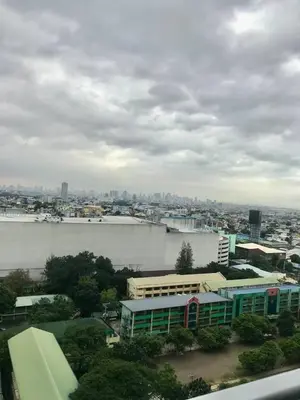 a view of a city with a river and buildings at 320 Santorini Staycation in Manila