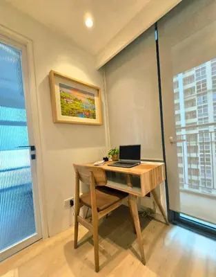 an office with a desk with a laptop on it at Hygge-ParkWest BGC near Grand Hyatt & Mitsukoshi in Manila