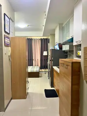 a room with a kitchen and a living room at City Comfort Studio at Sunshine 100 in Manila