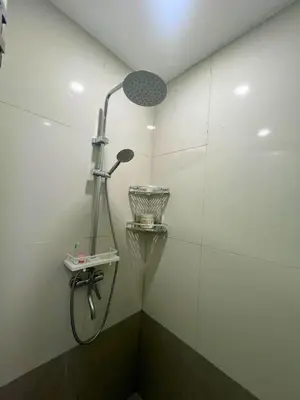 a shower in a bathroom with a shower head at City Comfort Studio at Sunshine 100 in Manila