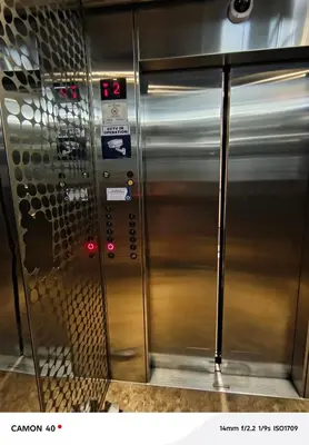 a row of metal elevator doors in a train at 150 Newport Boulevard Condominium - North Wing in Manila