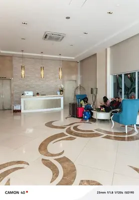 a lobby with people sitting in chairs and a carpet at 150 Newport Boulevard Condominium - North Wing in Manila