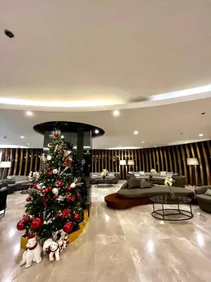 a christmas tree in the middle of a living room at Shore 2 residences tower 1 in Manila