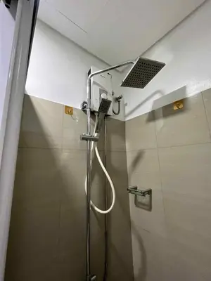 a shower with a shower head in a bathroom at Shore 2 residences tower 1 in Manila