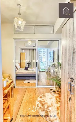 a room with a view of a bedroom with a bed at The Cozy Home of Calleigh in Allegra in Manila