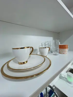two bowls on a plate on a kitchen counter at Pleasant Air Residences With Balcony and Fast Wi-Fi in Manila