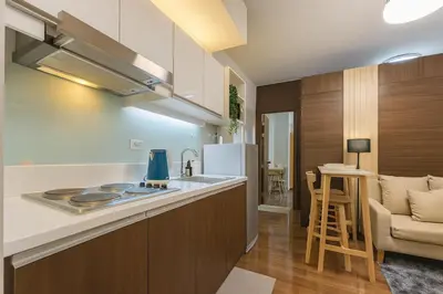 a kitchen with a sink and a counter top at 2BR Air Residence, Makati City in Manila