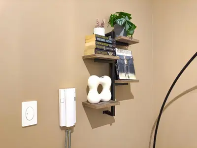 a room with a book shelf on the wall at 1BR Makati, Air Residences M010 in Manila