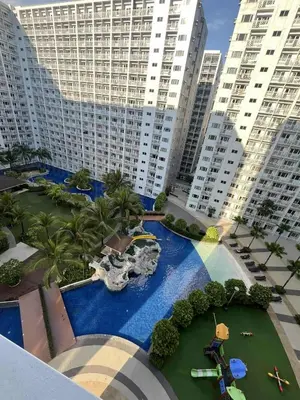 an aerial view of a resort with a water park at 2 Bedroom Shore Residence Mall Of Asia Complex in Manila