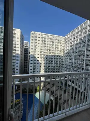 a balcony with a view of a large building at 2 Bedroom Shore Residence Mall Of Asia Complex in Manila