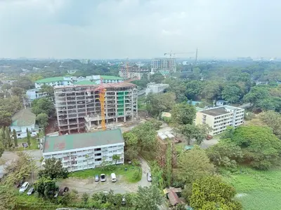 an overhead view of a city with buildings and trees at Panoramic Views 2BR Family Stay in Mckinley BGC in Manila
