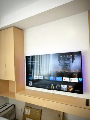 a large flat screen tv hanging on a wall at Prime Zen in Silang