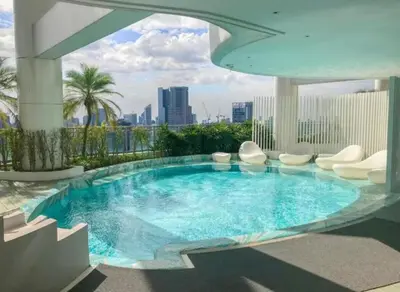 a swimming pool on top of a building at Cozy Crib at Acqua Residences - Rockwell Views in Manila