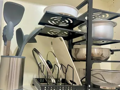a shelf with cooking utensils in a kitchen at 1 Bedroom Condo Unit Near SM City Sucat and NAIA Terminal in Manila