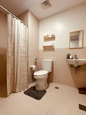 a bathroom with a toilet and a sink at Semi Furnished Condo at Sta Rosa Zadia Tower 2 in Sampong