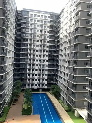 an aerial view of two tall buildings with a swimming pool at AR Pahinga Place - The Pause House in Manila