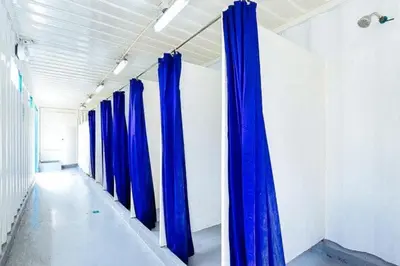a row of blue curtains in a hallway at CitiHub Shaw Santa Mesa in Manila