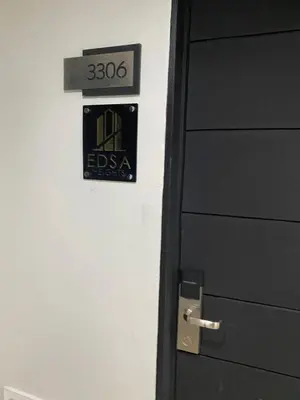 a door with a sign that reads esa on it at EDSA Heights Penthouse Unit 3306 Ama Tower Residences in Manila