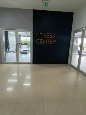 an entrance to a fitness center with two glass doors at EDSA Heights Penthouse Unit 3306 Ama Tower Residences in Manila