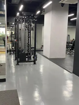 a gym with rows of equipment on the floor at EDSA Heights Penthouse Unit 3306 Ama Tower Residences in Manila