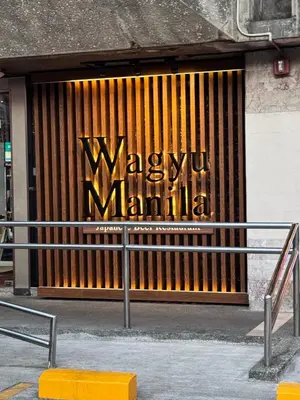 a building with a sign on the front of it at Kaizen cozy and comfortable condo at Red Residences Makati in Manila