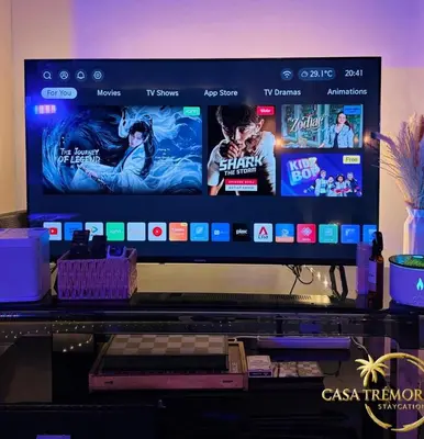 a computer monitor sitting on top of a desk at Azure Staycation by Casa Tremora in Manila