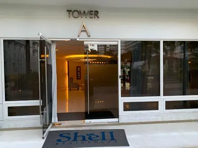 a shil recruitment sign in front of a building at Kathys Crib 11th flr 2 at Shell Residence pool view in Manila