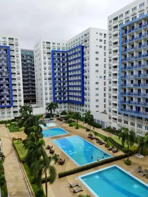 an aerial view of a large apartment complex with large pools at Sea Residence Condotel Pasay in Manila