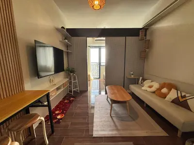 a living room with a couch and a table at Condo in Makati in Manila